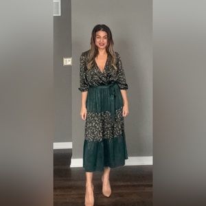 Bohemian floral and emerald colored long sleeve mid-length dress